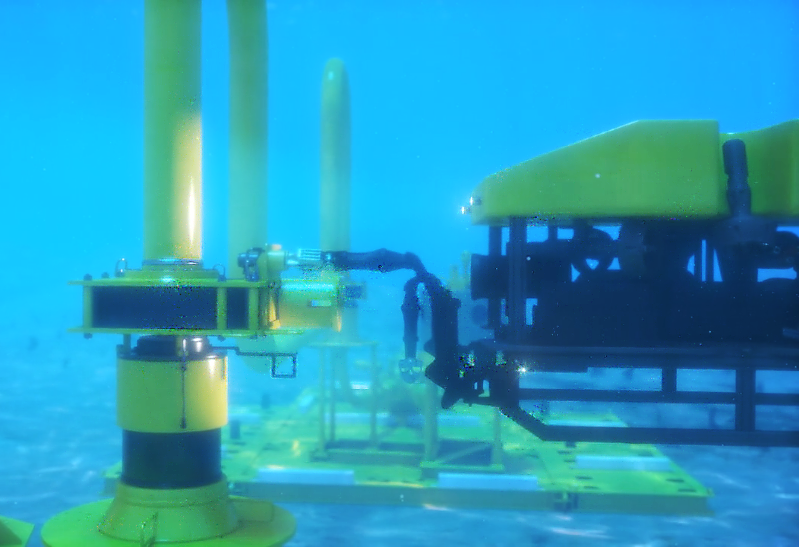 This is a 3D rendered image from Trinity's mechanical animation demonstrating the Oil States underwater pipeline system's multi-segmented clamp installation. This image displays the ROV inserting a new seal on the bottom of the tool, the ROV will cycle the soft land system which captures the old seal and deposits the new seal. 