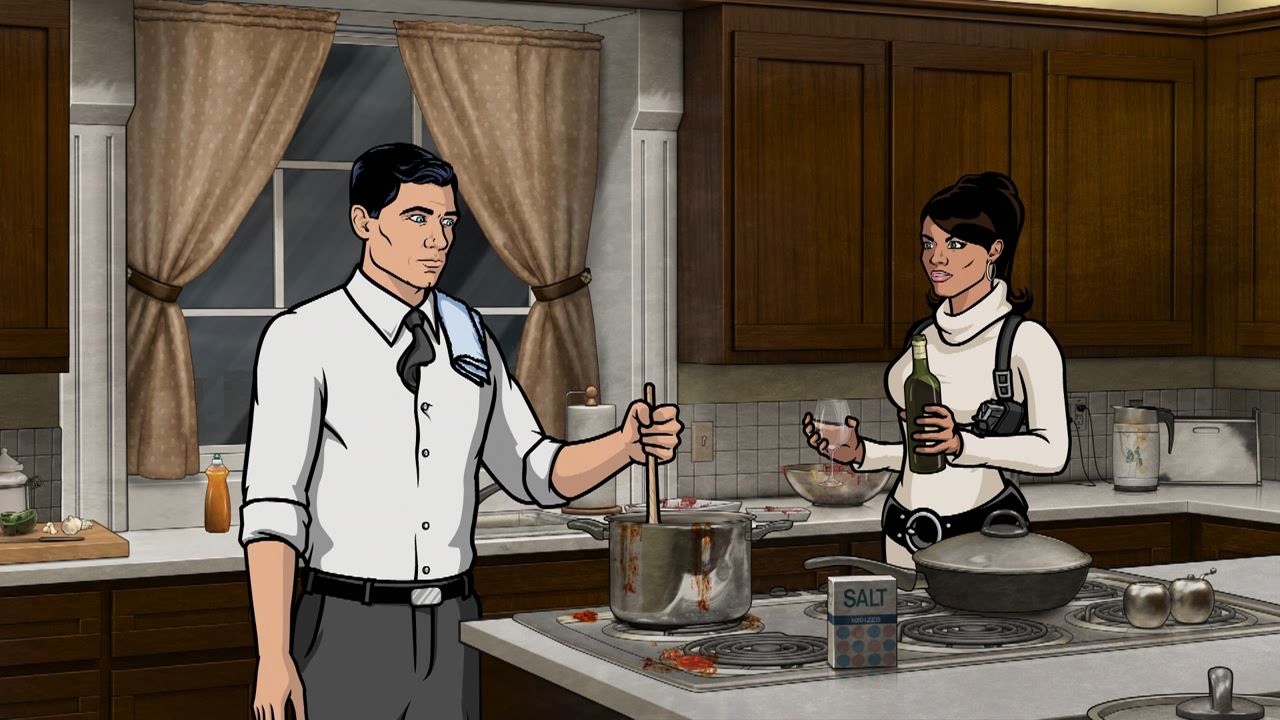 Archer and Lana cooking. With wine!